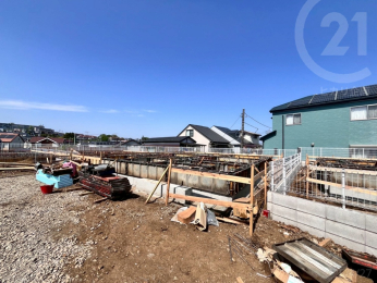  1号棟付近／現況更地。完成は7月頃を予定しています。